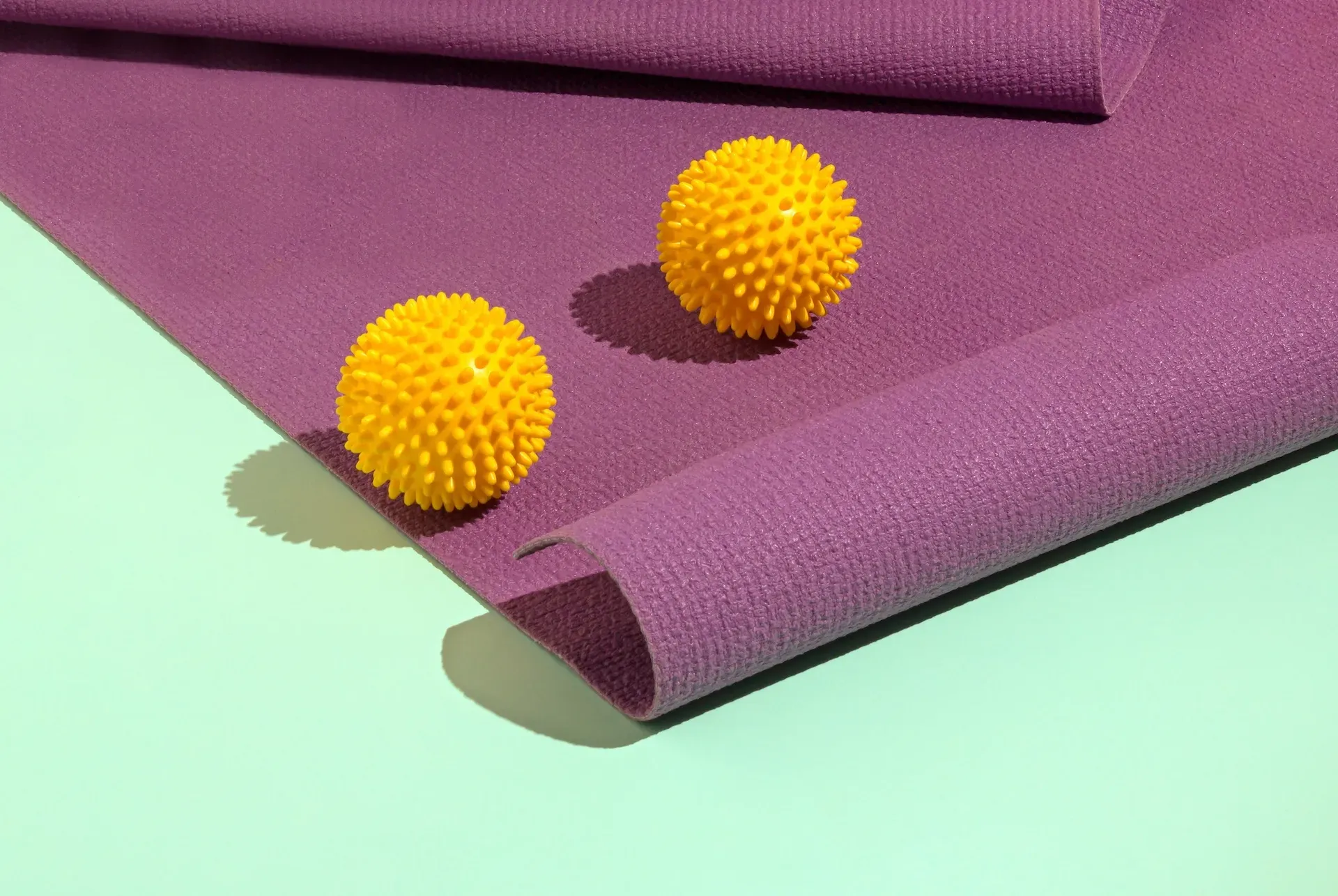 Spiky balls on a yoga mat