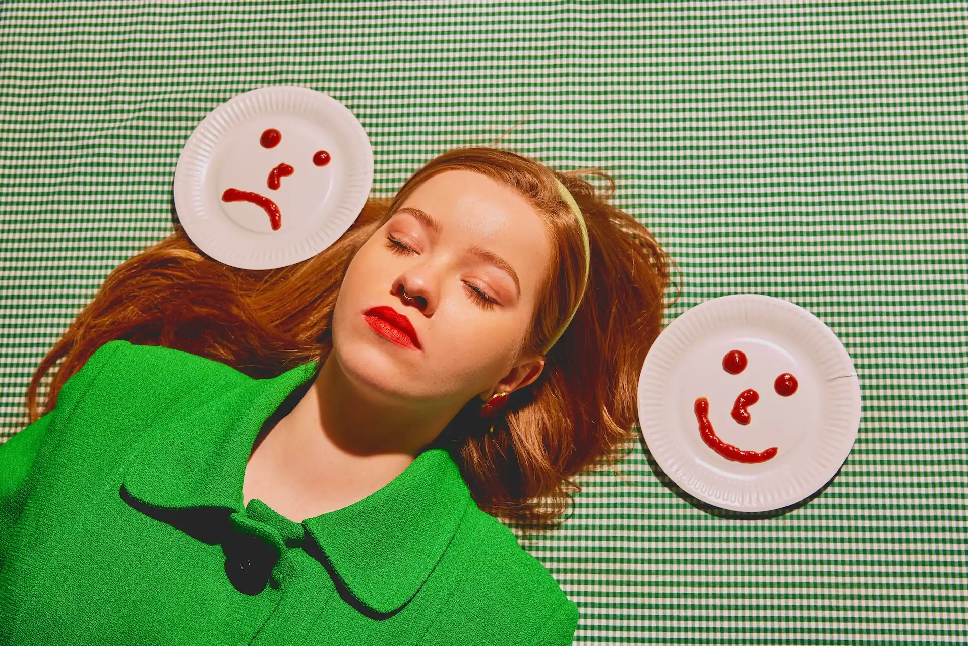 Woman laying down next to two plates