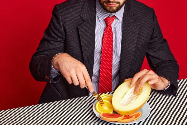 Man slicing a melon