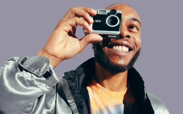 Man holding an old-fashioned camera